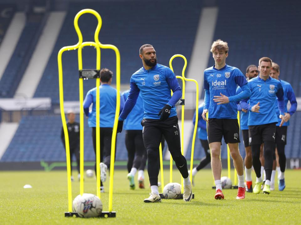 Albion players warming up on the pitch at The Hawthorns during a training session