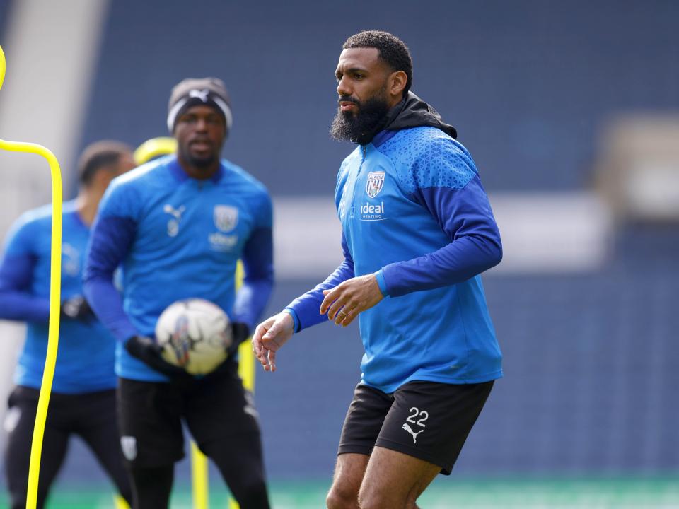 Yann M'Vila warming up during a training session at The Hawthorns