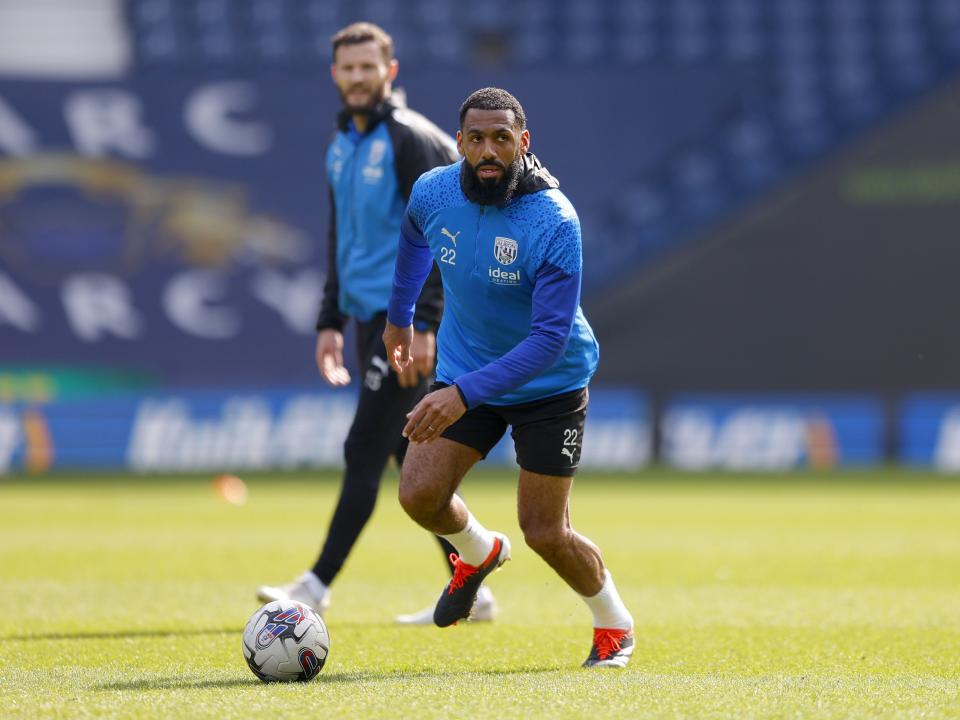 Yann M'Vila running with the ball during a training session at The Hawthorns