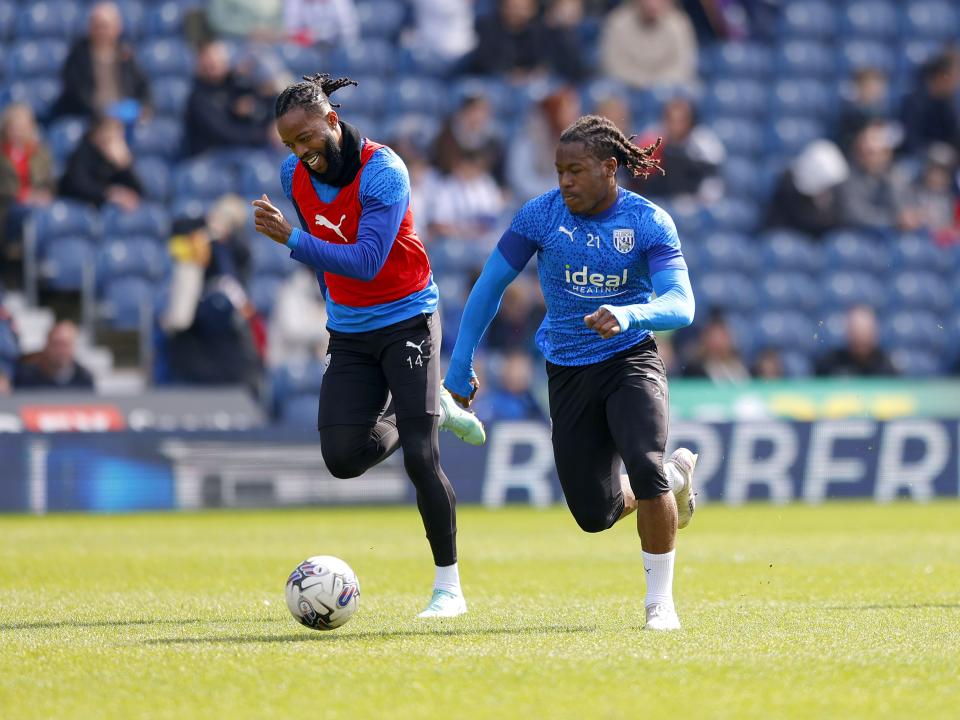 Brandon Thomas-Asante and Nathaniel Chalobah chasing after the ball during a training session at The Hawthorns