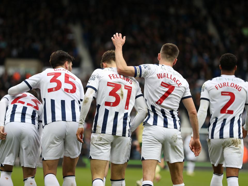 Tom Fellows celebrates scoring against Bristol City with several team-mates