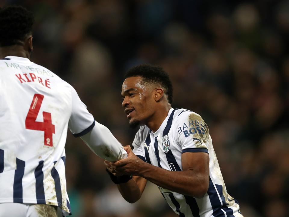 Grady Diangana shakes hands with Cedric Kipre after scoring against Coventry 