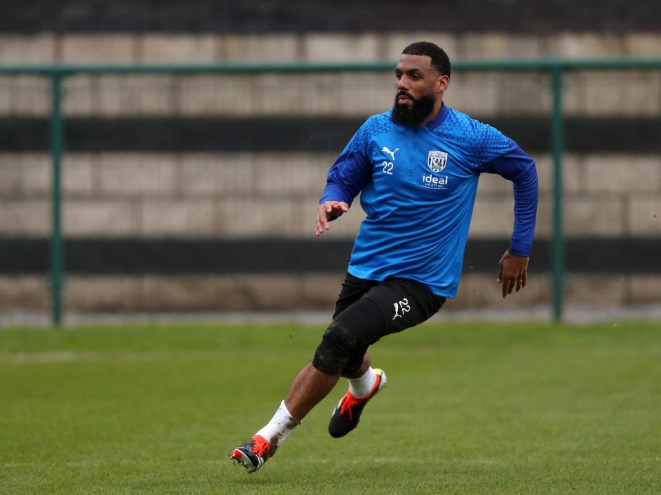 Yann M'Vila running during a training session
