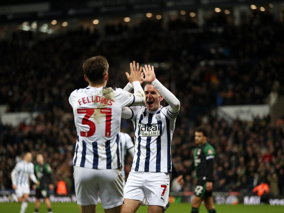 Tom Fellows and Jed Wallace high five after Grady Diangana's goal against Coventry 