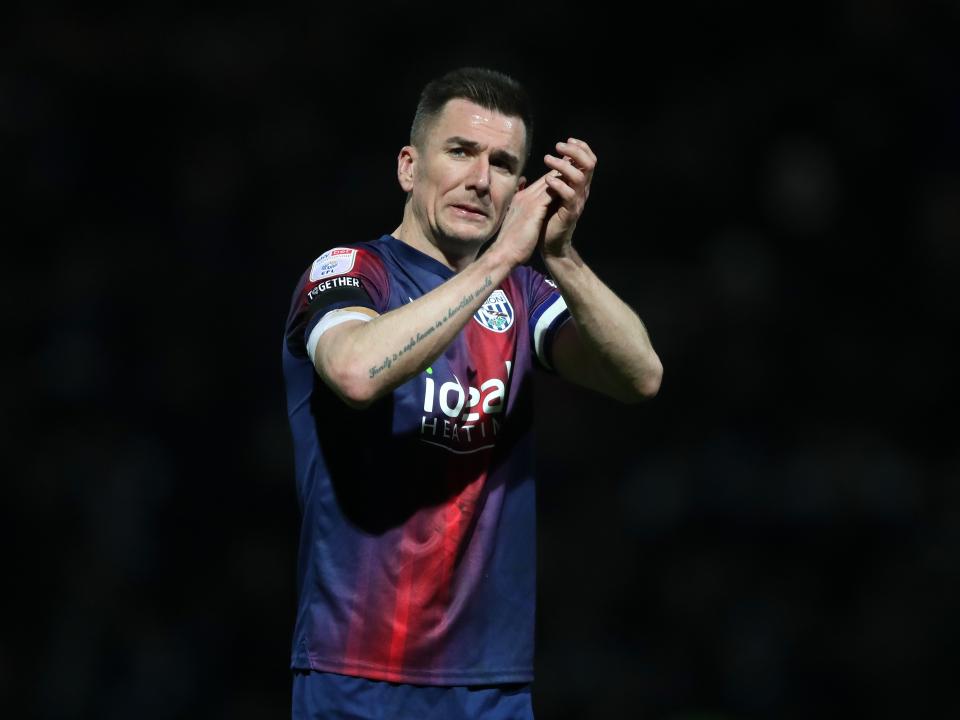 Jed Wallace applauds Albion fans after the full-time whistle at QPR 