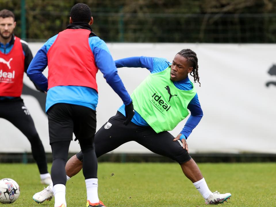 Brandon Thomas-Asante stretches to try and win the ball during a training session