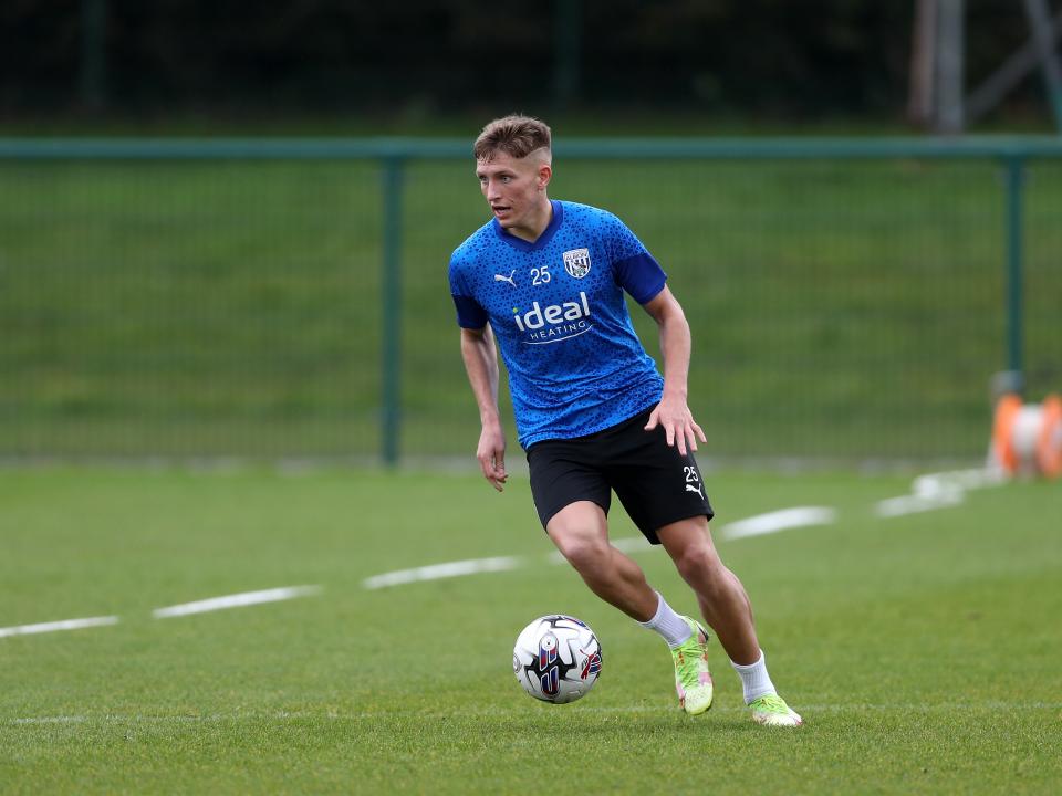 Callum Marshall running with the ball during a training session