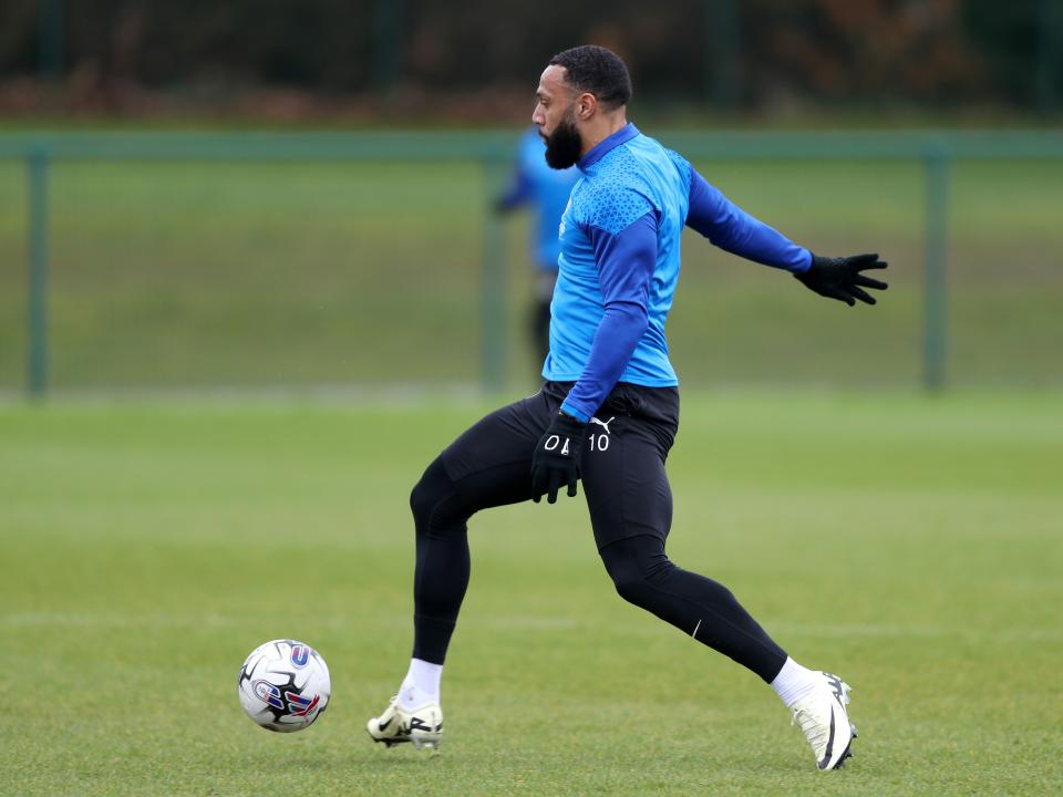 Matty Phillips running with the ball during a training session