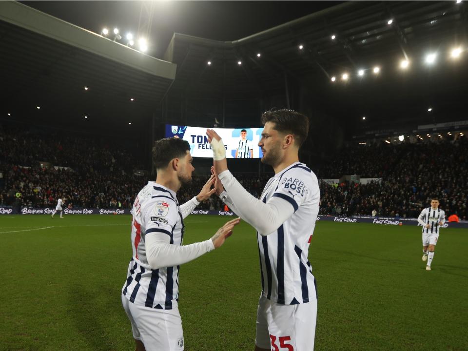 Alex Mowatt and Okay Yokuslu high five each other before playing Coventry 