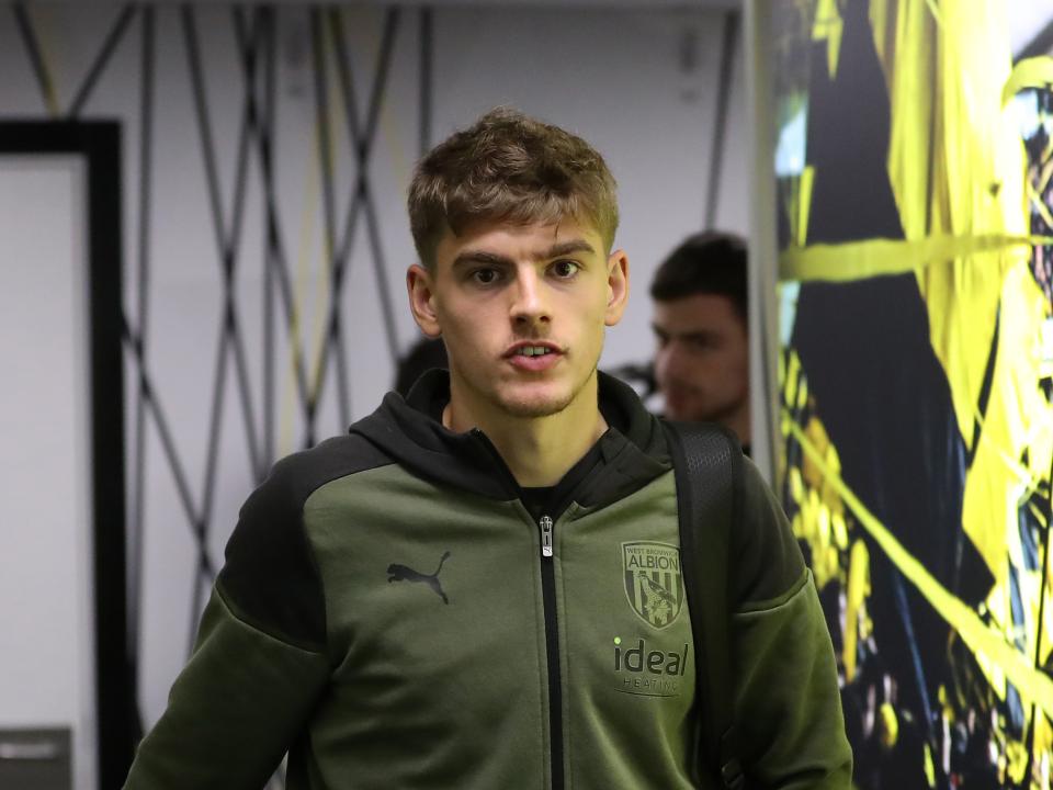 Tom Fellows arriving for an Albion match in his club tracksuit 