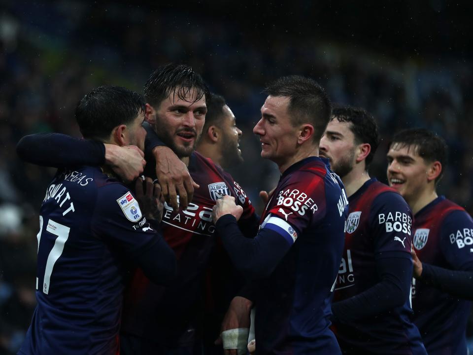 An image of Okay Yokuslu celebrating his goal against Huddersfield