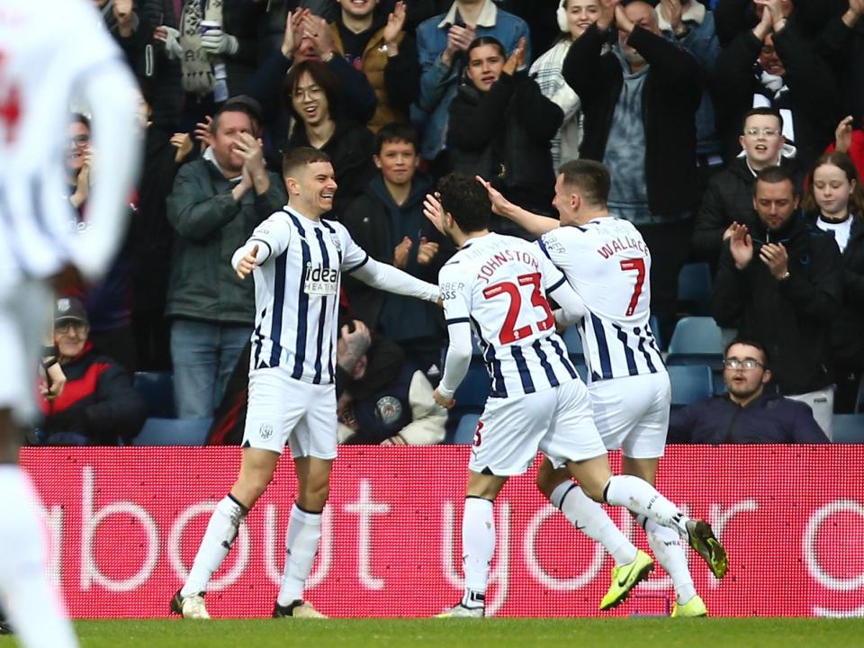 Jed Wallace celebrates scoring against Bristol City with Conor Townsend and Mikey Johnston 