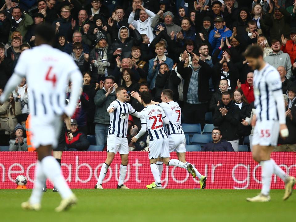 Jed Wallace celebrates scoring against Bristol City with Conor Townsend and Mikey Johnston