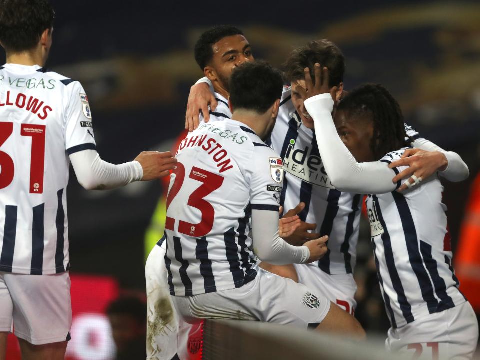 Adam Reach is mobbed by team-mates after setting up Brandon Thomas-Asante's goal against Rotherham at The Hawthorns