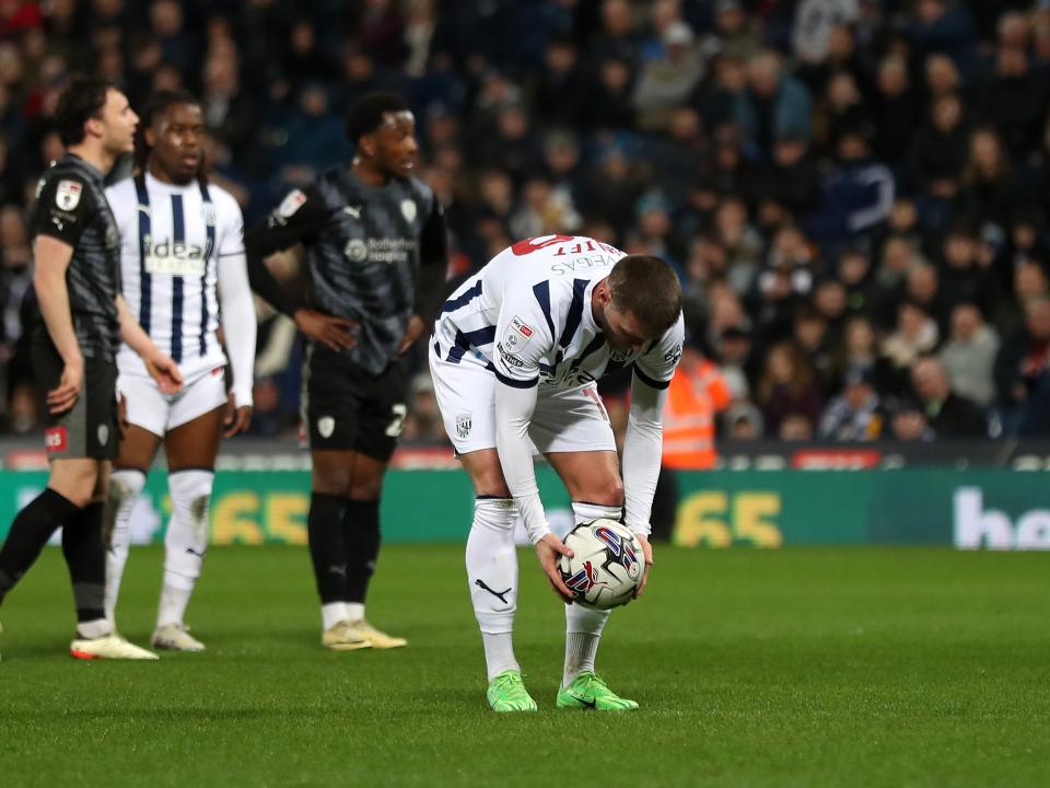 John Swift places the ball on the penalty spot against Rotherham United at The Hawthorns