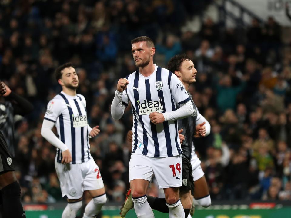 John Swift celebrates scoring a penalty against Rotherham