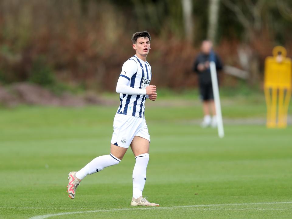 Archie Kirton in action for Albion's U18 team wearing the home kit