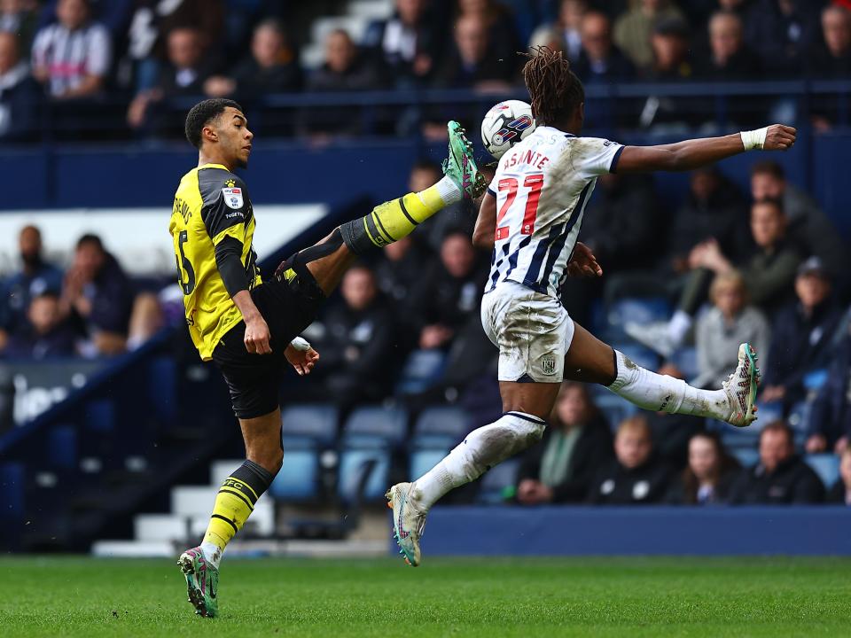 Brandon Thomas-Asante jumps for the ball against Watford 