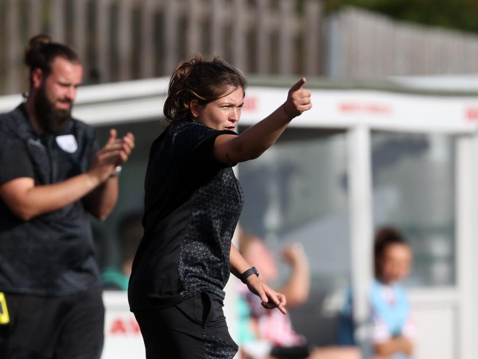 Siobhan Hodgetts-Still on the side of the pitch wearing black Albion training gear