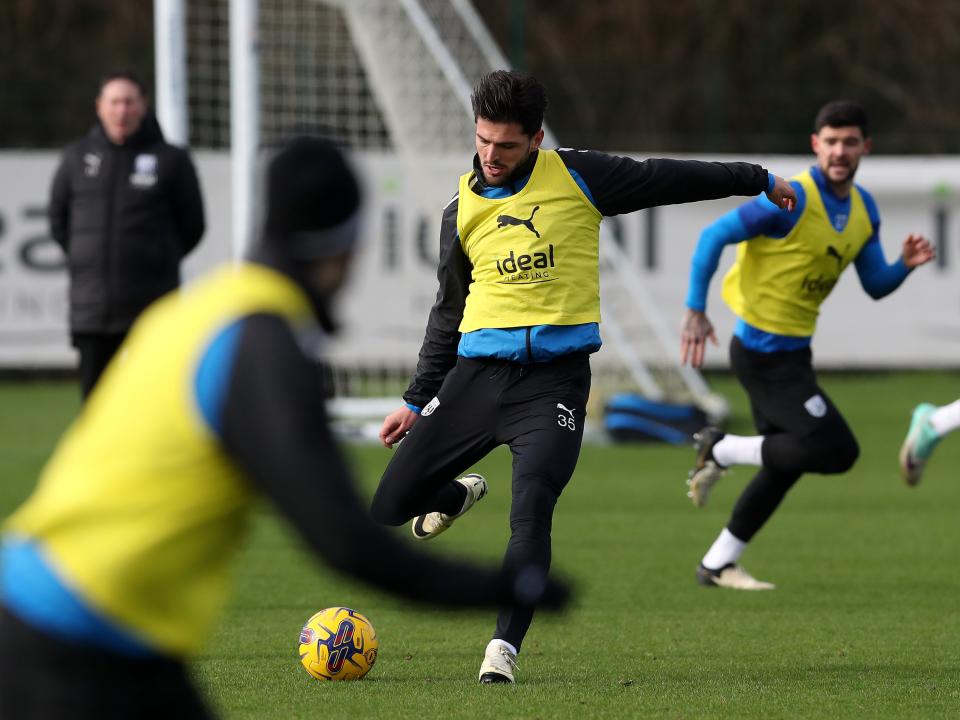An image of Okay Yokuslu kicking a ball in training