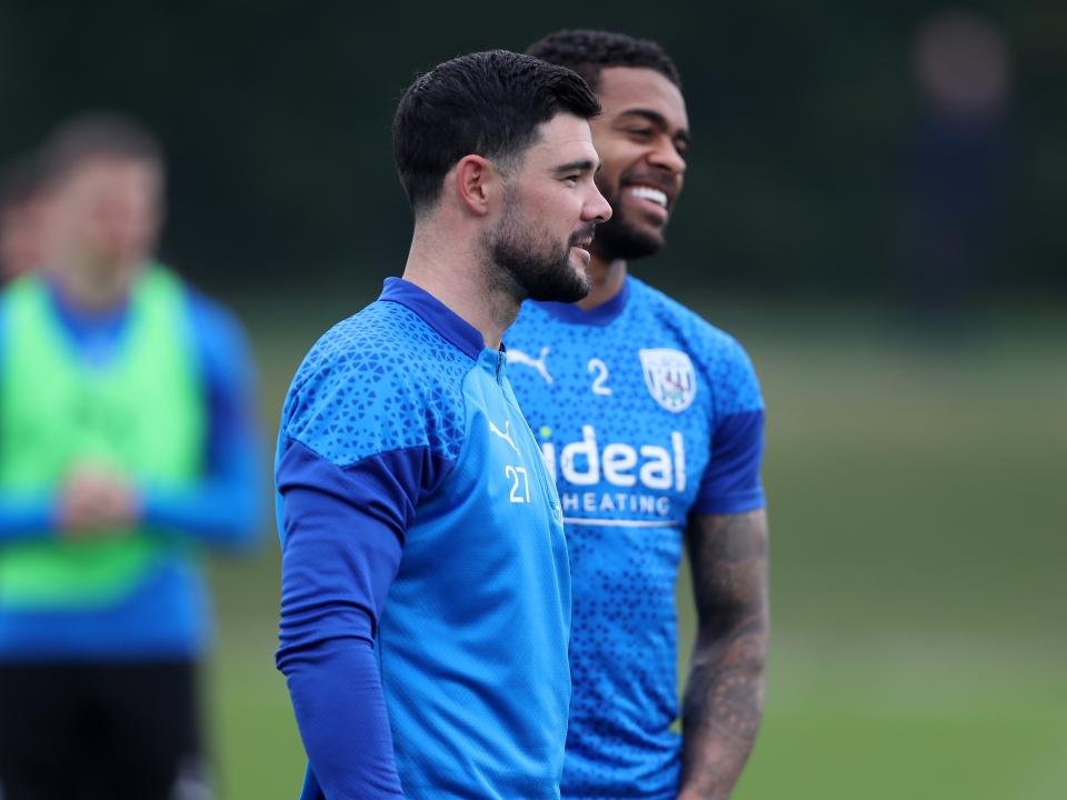 Alex Mowatt and Darnell Furlong smiling during a training session