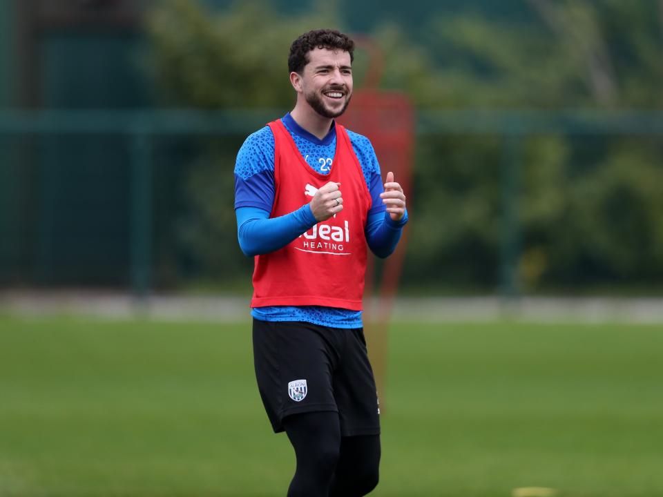 Mikey Johnston smiling during a training session