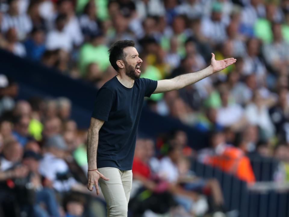 Carlos Corberán delivering a message to his players on the sideline against Southampton at The Hawthorns