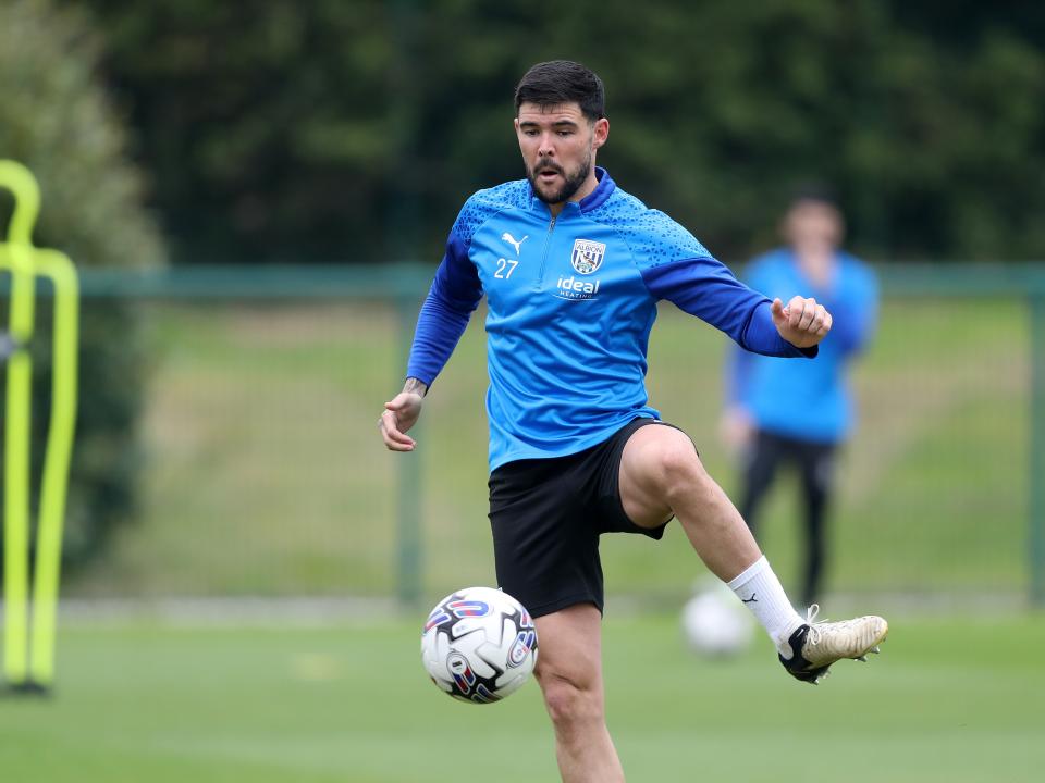 Alex Mowatt passing the ball during a training session