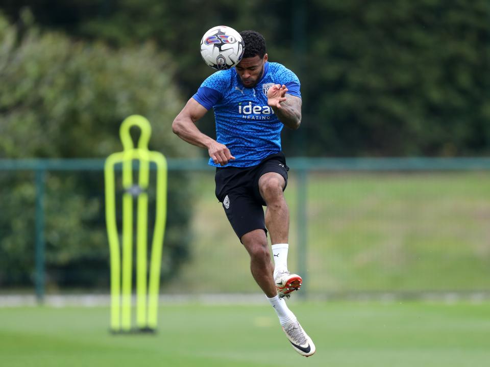 Darnell Furlong heading the ball during a training session