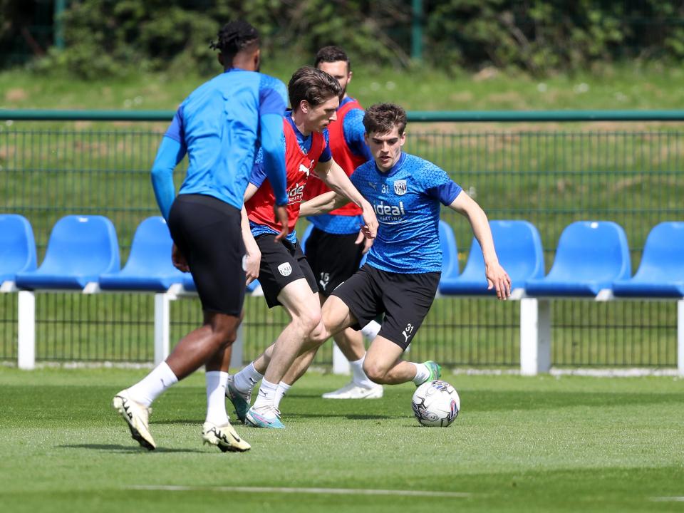 Adam Reach on the ball with Tom Fellows close by during training 
