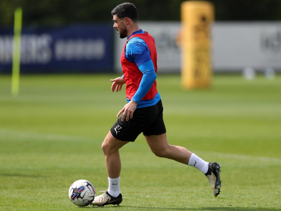 Alex Mowatt on the ball during training