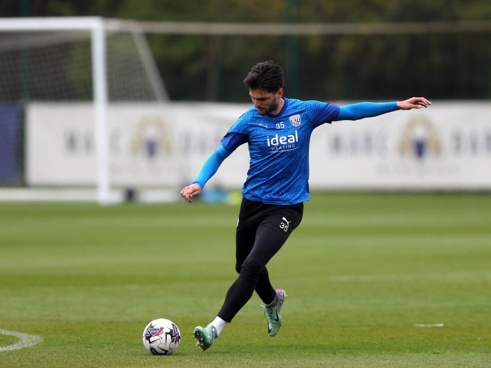Okay Yokuslu striking the ball during a training session 