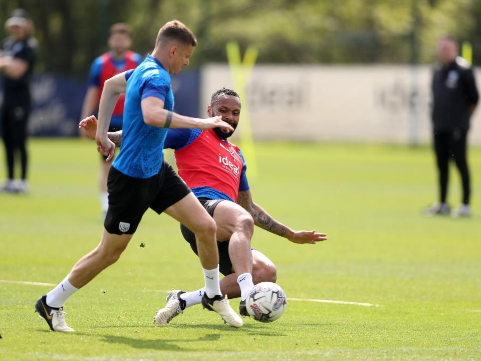 Kyle Bartley tackling Conor Townsend during training 