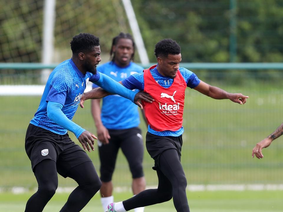 Cedric Kipre and Grady Diangana battle for the ball during training 