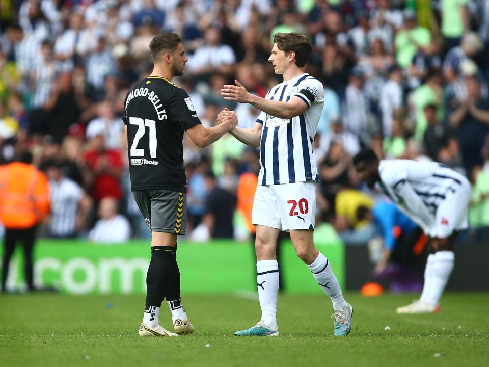 Adam Reach and Taylor Harwood-Bellis embrace after the full-time whistle at The Hawthorns 