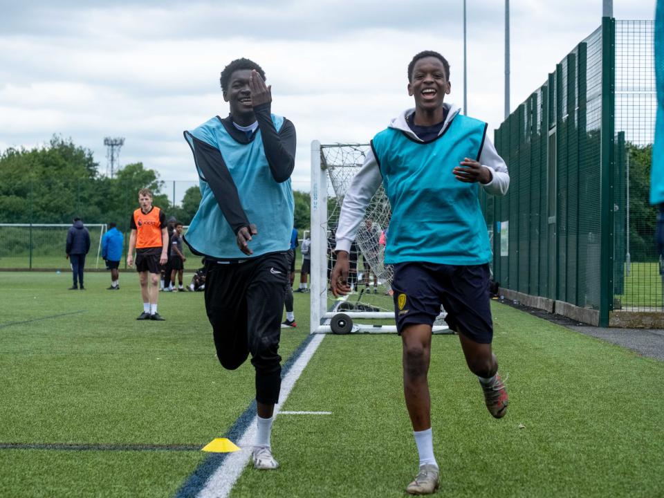 Two players celebrating a goal.