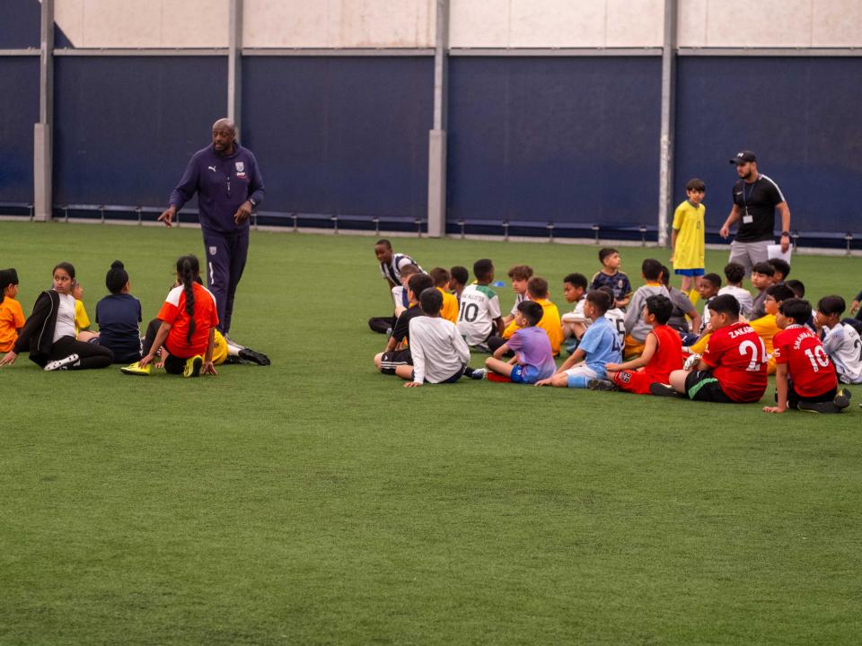Participants at our South Asian Emerging Talent Festival receive instructions from The Albion Foundation coaches whilst inside the Academy Dome.