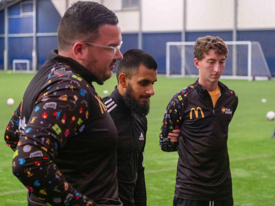 Eesa Amjid takes questions from youngsters during their McDonald's Fun Football Session.