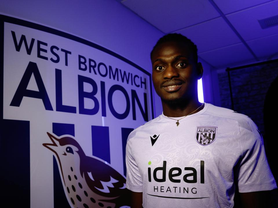 Ousmane Diakité posing for the camera inside a TV studio 