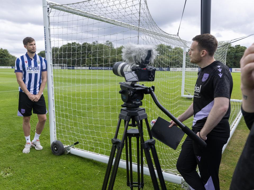 Paddy McNair is interviewed by WBA TV while stood up against a goal post 