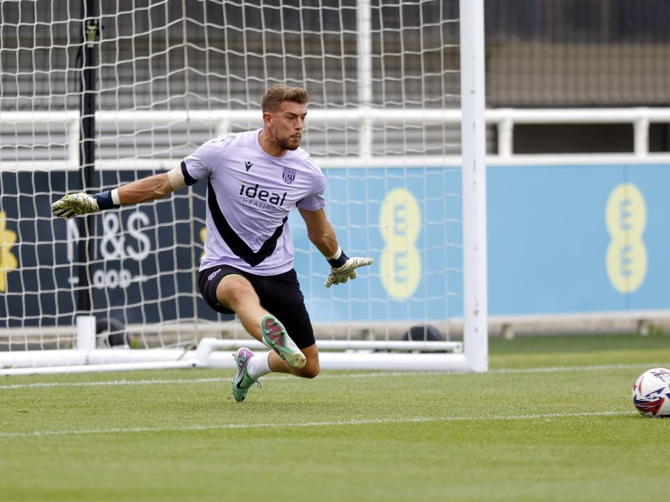 An image of Alex Palmer warming up for Albion's friendly against Peterborough