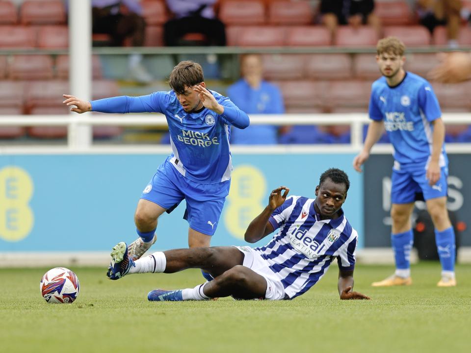 An image of Ousmane Diakite putting in a tackle during Albion's friendly against Peterborough