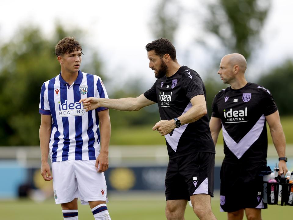 An image of Cole Deeming receiving advice during Albion's friendly against Peterborough