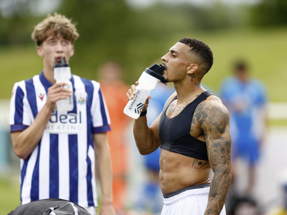 An image of Karlan Grant and Harry Whitwell drinking after Albion's friendly against Peterborough