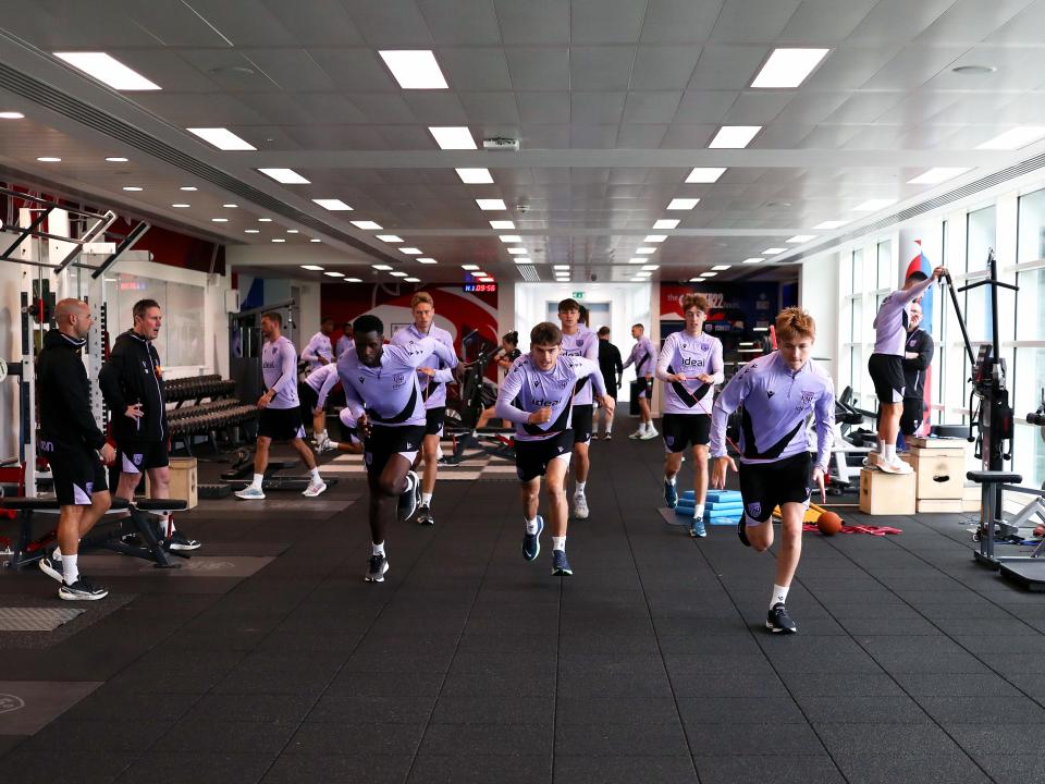 A large group of Albion players working in the gym at St. George's Park