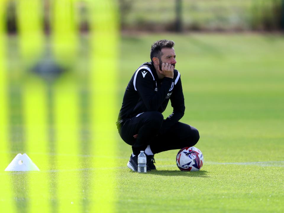 Carlos Corberán watching over a training session 