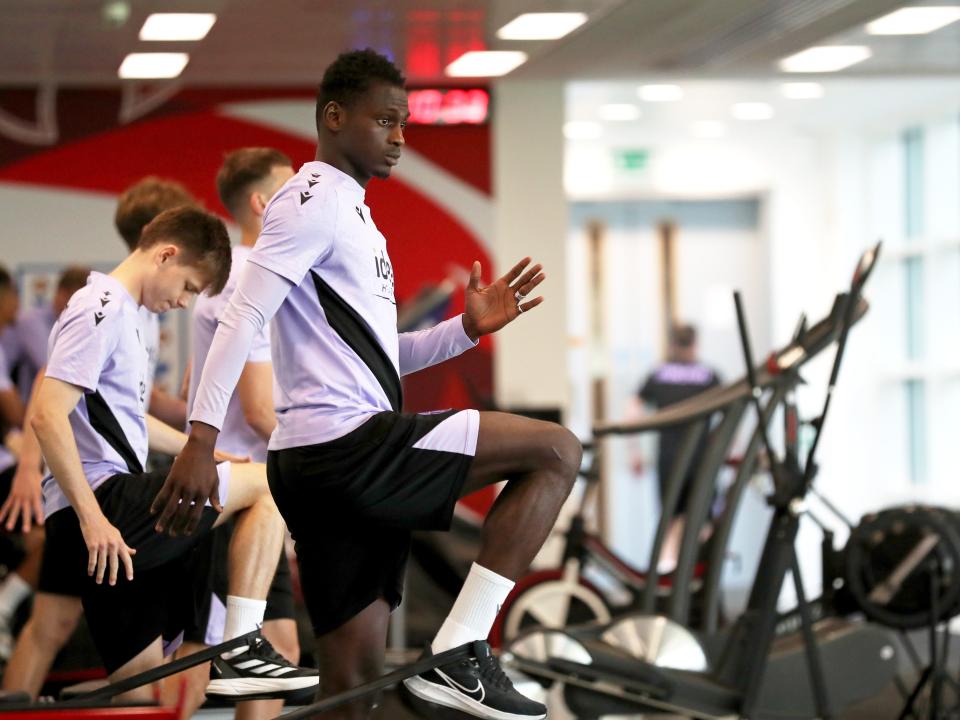 Ousmane Diakité stretching in the gym at St. George's Park