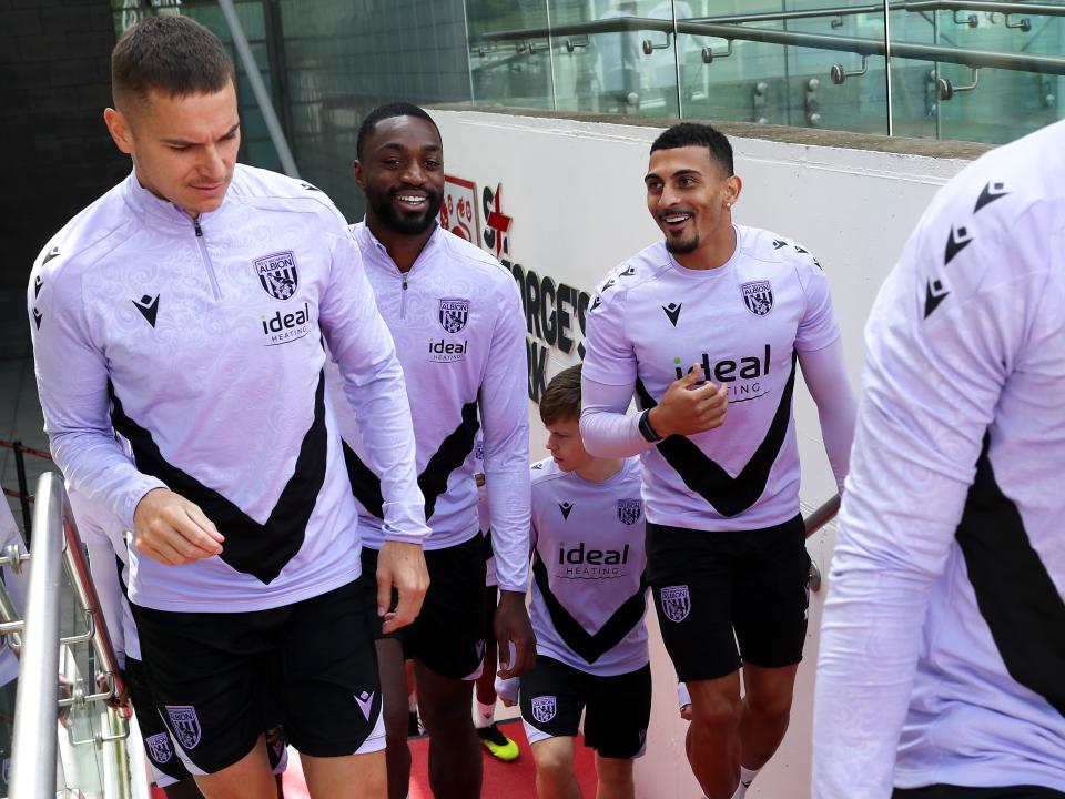 Conor Townsend, Semi Ajayi and Karlan Grant walking up the steps to the training pitch at St. George's Park
