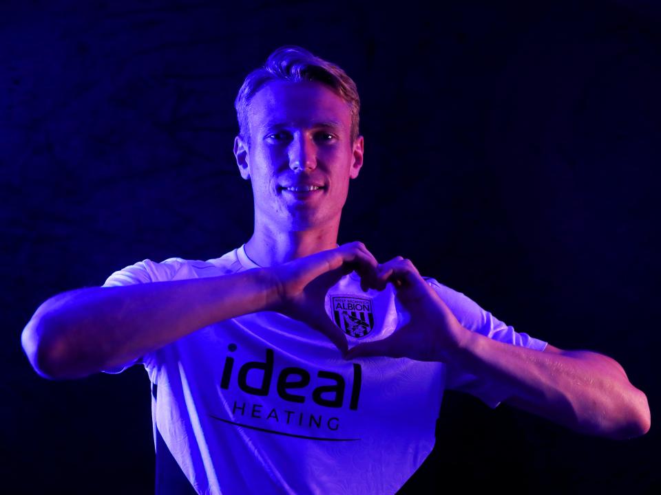Torbjørn Heggem making a heart shape with his hands 