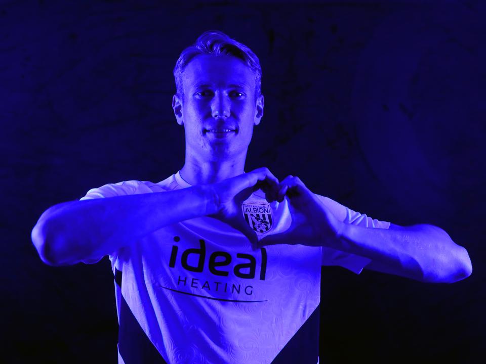 Torbjørn Heggem making a heart shape with his hands 